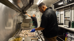 Douglas and Rafael working in their food truck, The Torta Chaser