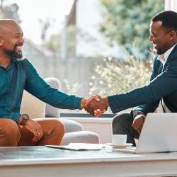 Two businessmen shaking hands in agreement